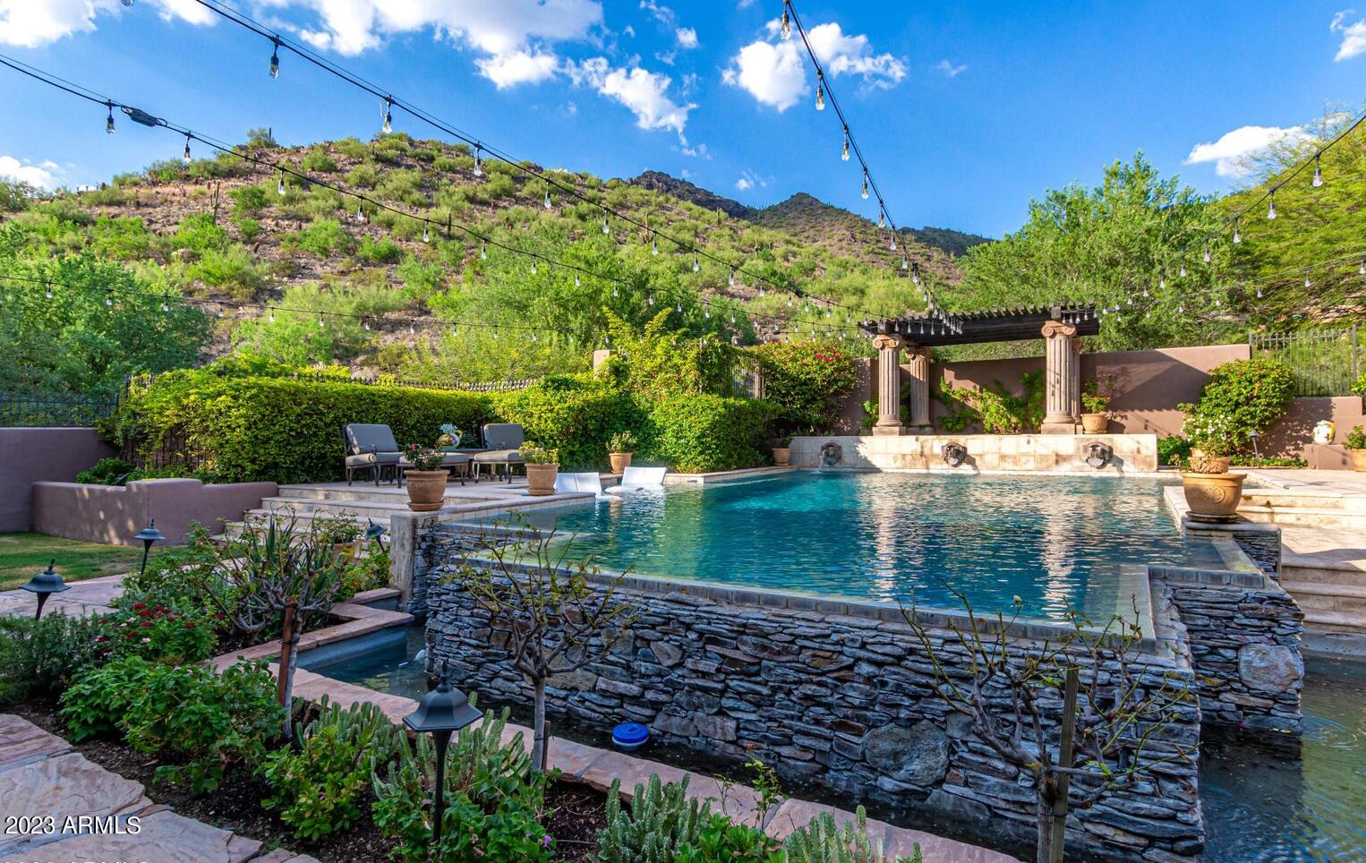 16469 North 113th Way Scottsdale, AZ 85255 - Photo 32 of 47 a view of a swimming pool with a patio