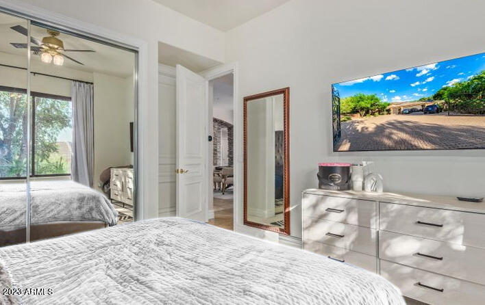 16469 North 113th Way Scottsdale, AZ 85255 - Photo 35 of 47 a bedroom with a bed and a dresser with mirror