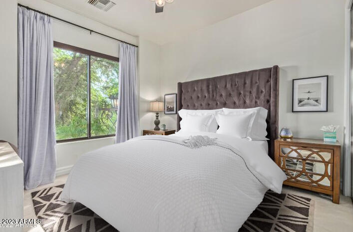 16469 North 113th Way Scottsdale, AZ 85255 - Photo 36 of 47 a bedroom with a bed and wooden floor