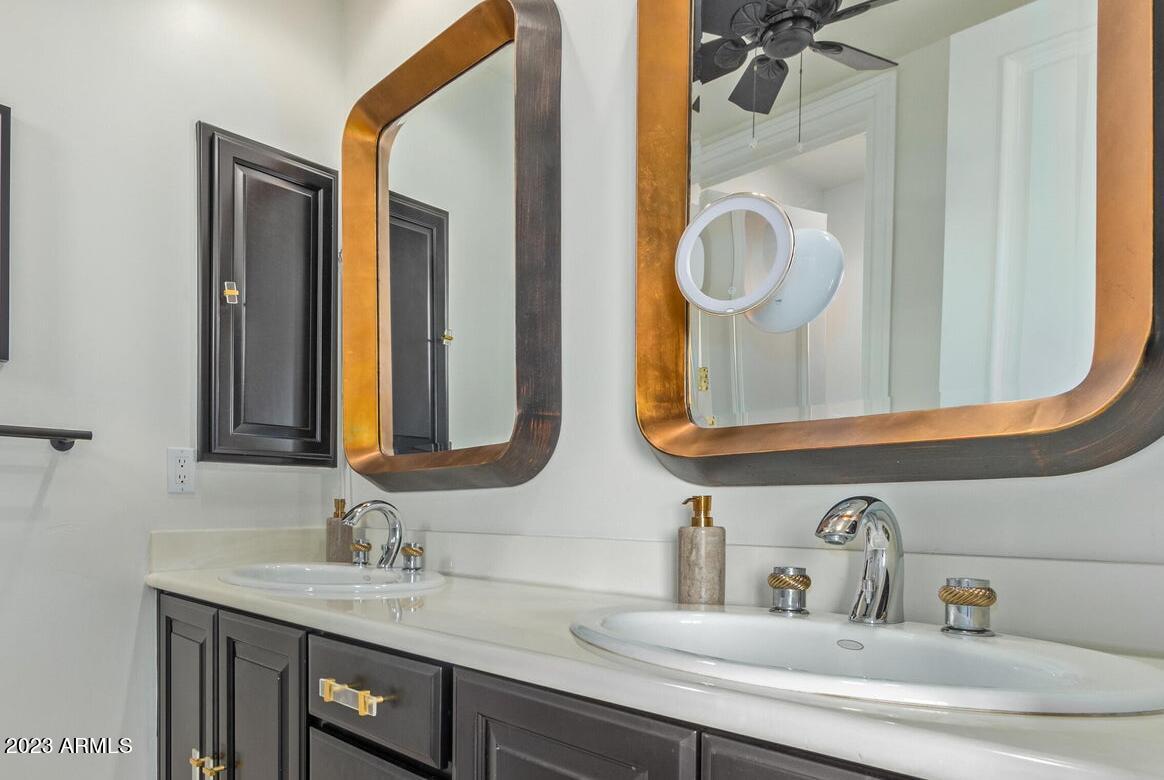 16469 North 113th Way Scottsdale, AZ 85255 - Photo 37 of 47 a bathroom with a sink and a mirror