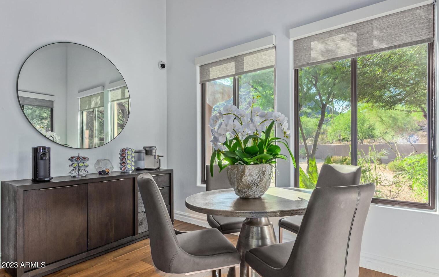 16469 North 113th Way Scottsdale, AZ 85255 - Photo 8 of 47 a view of a dining room with furniture window and wooden floor