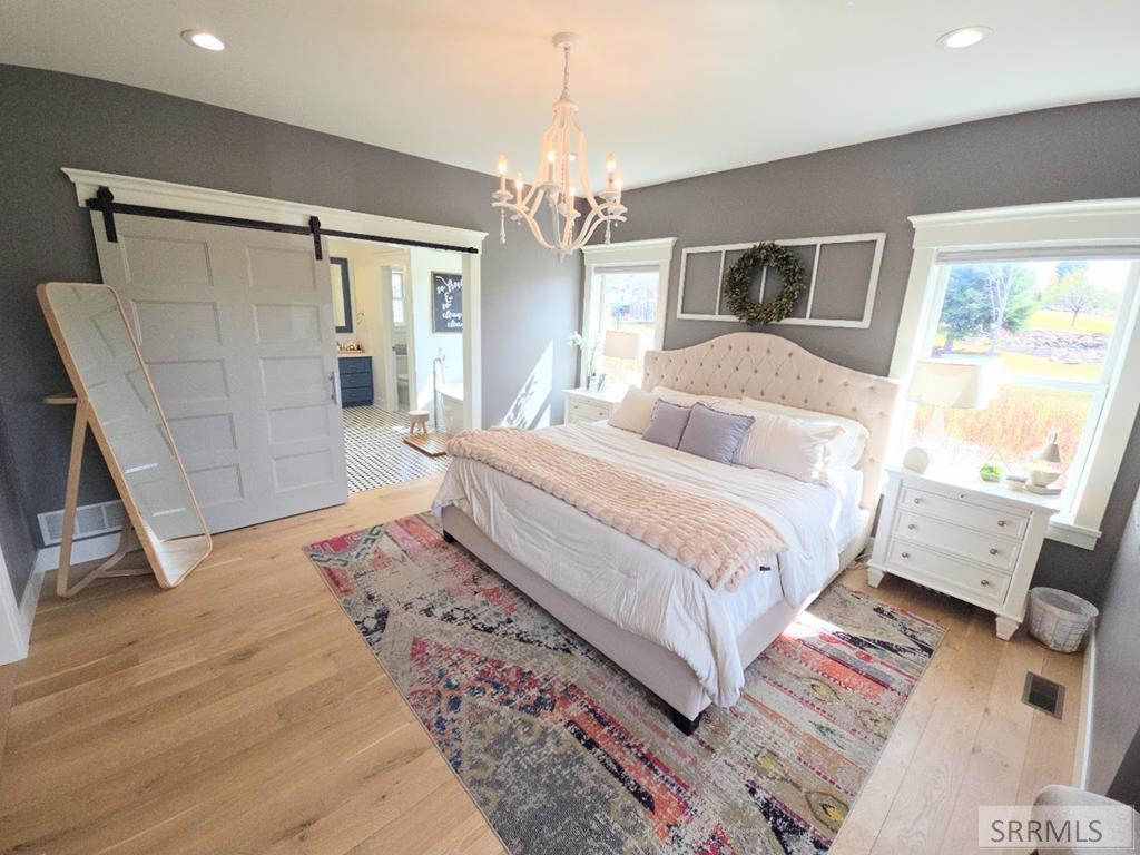 2155 Foothill Road Idaho Falls, ID 83401 - Photo 31 of 78 BARN-DOOR TO BATHROOM