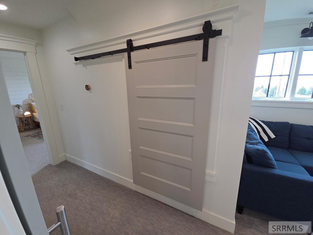 2155 Foothill Road Idaho Falls, ID 83401 - Photo 57 of 78 BARNDOOR OVER LINEN CUPBOARD
