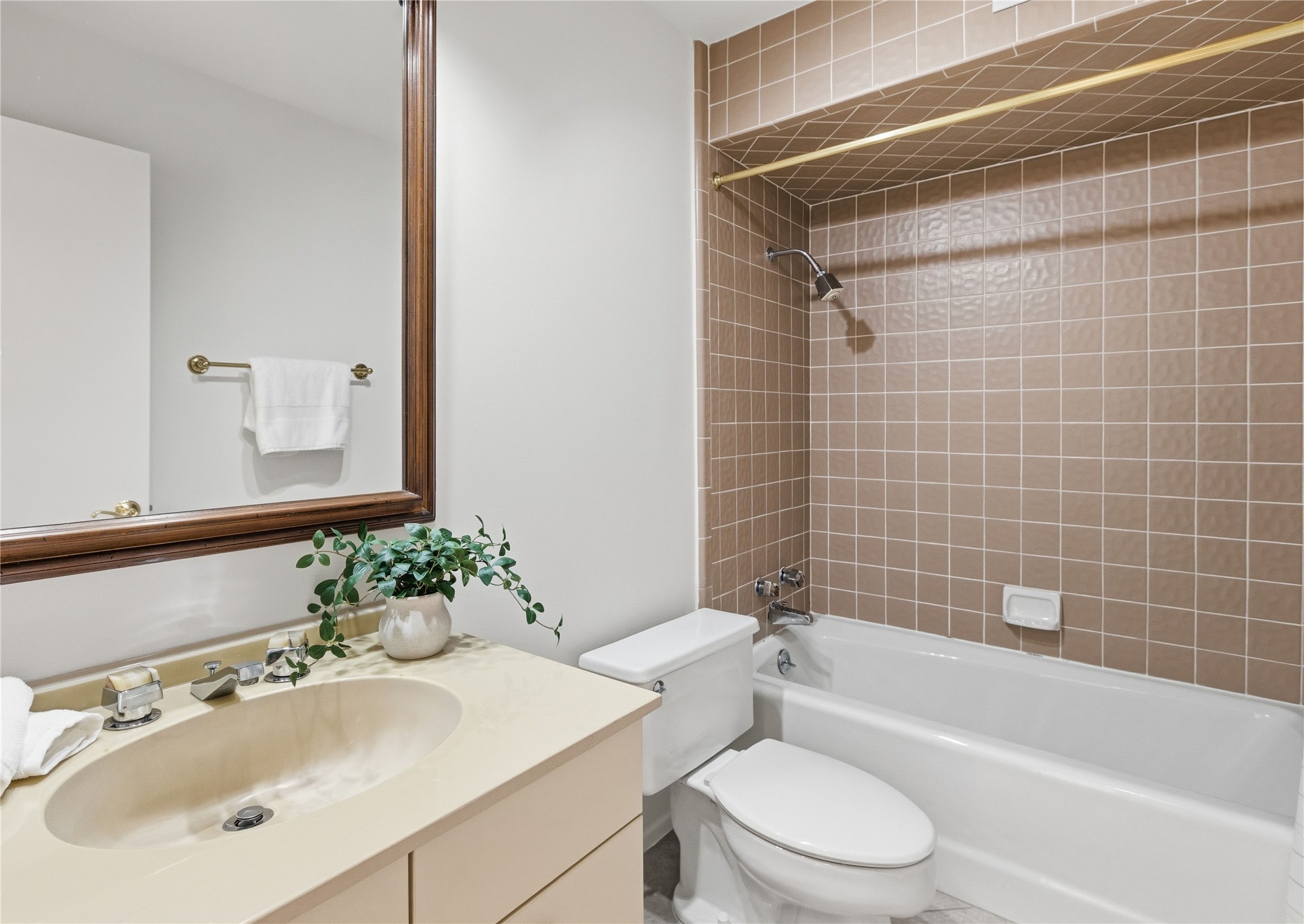 40 North Interstate Highway 35, Unit 7B1 Austin, TX 78701 - Photo 14 of 21 A 2nd bathroom features a classic vanity complementing a tiled shower and bathtub.