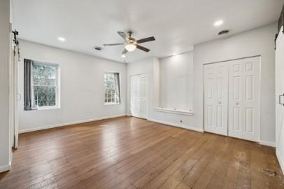 8113 Highway 22, Unit 1 New Alexandria, PA 15670 - Photo 19 of 37 a view of an empty room with a window and wooden floor
