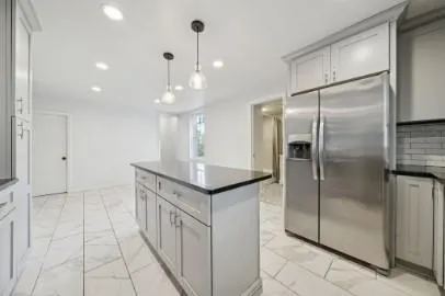 a bathroom with a shower and a sink