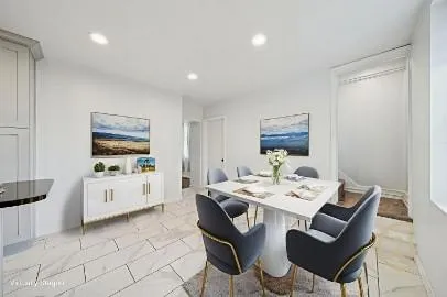 a living room with furniture and white appliances