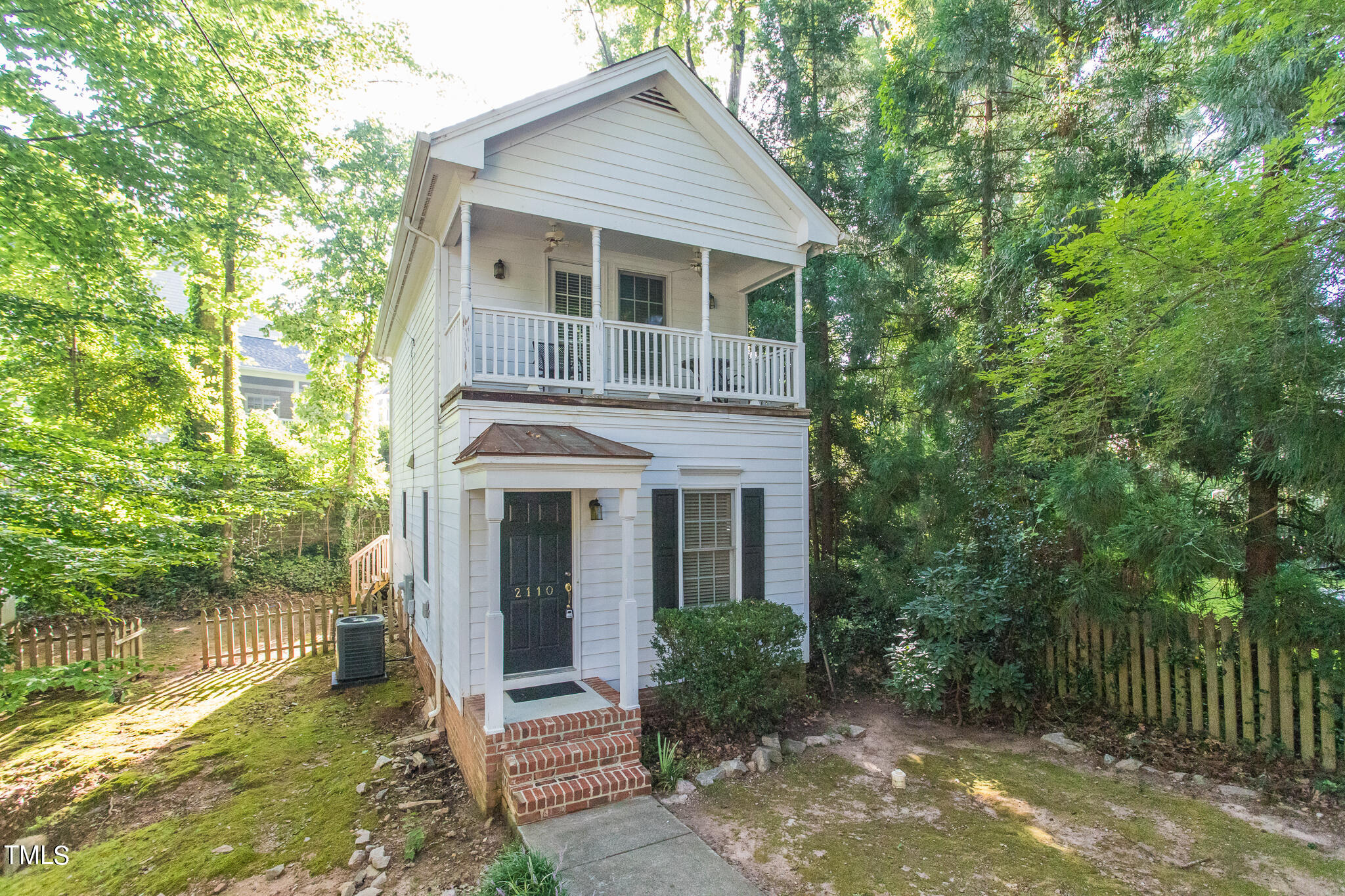 2110 Reaves Drive Raleigh, NC 27608 - Photo 1 of 36 a view of house with a yard and potted plants
