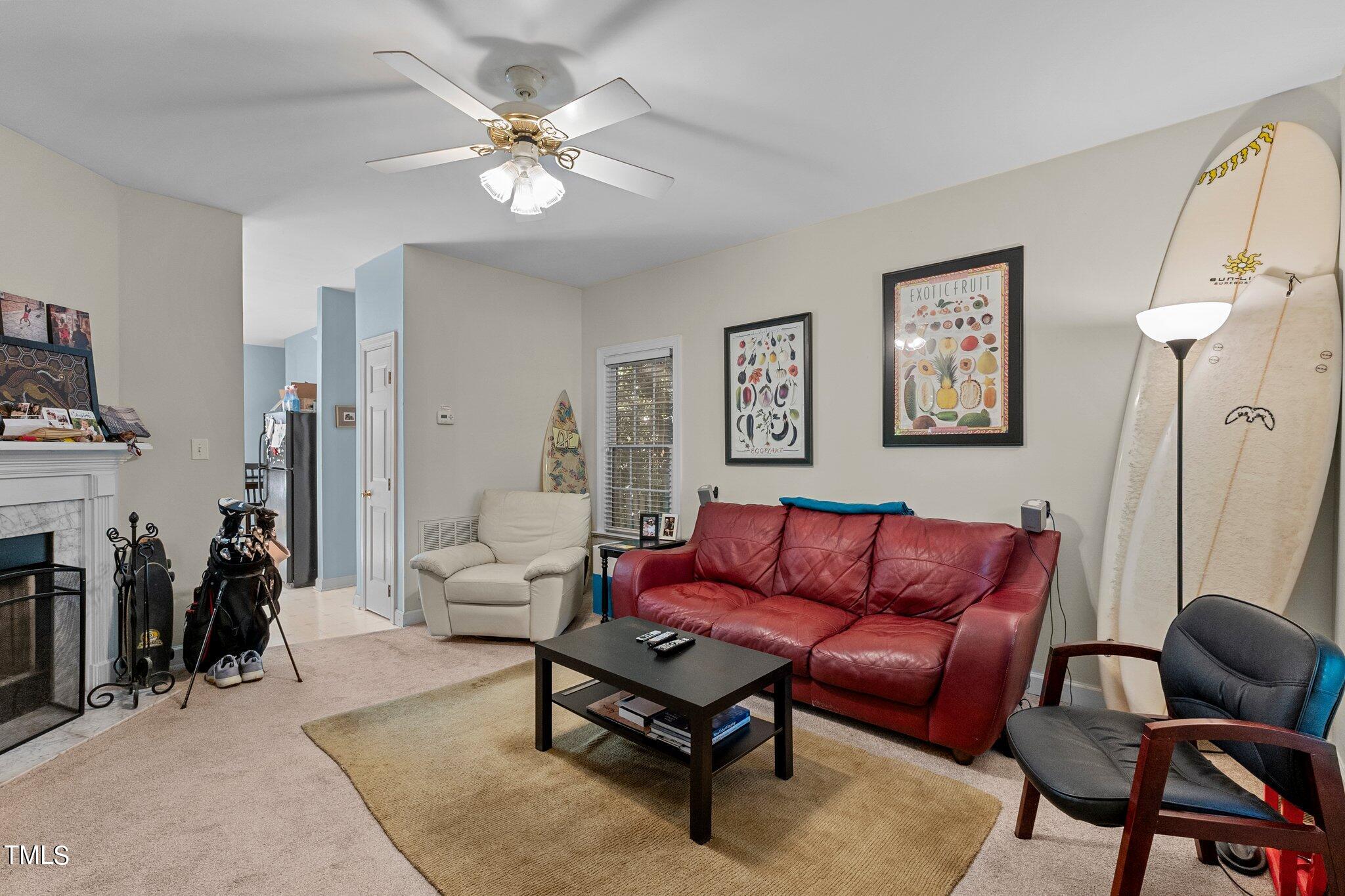 2110 Reaves Drive Raleigh, NC 27608 - Photo 13 of 36 a living room with furniture a couch and a chandelier