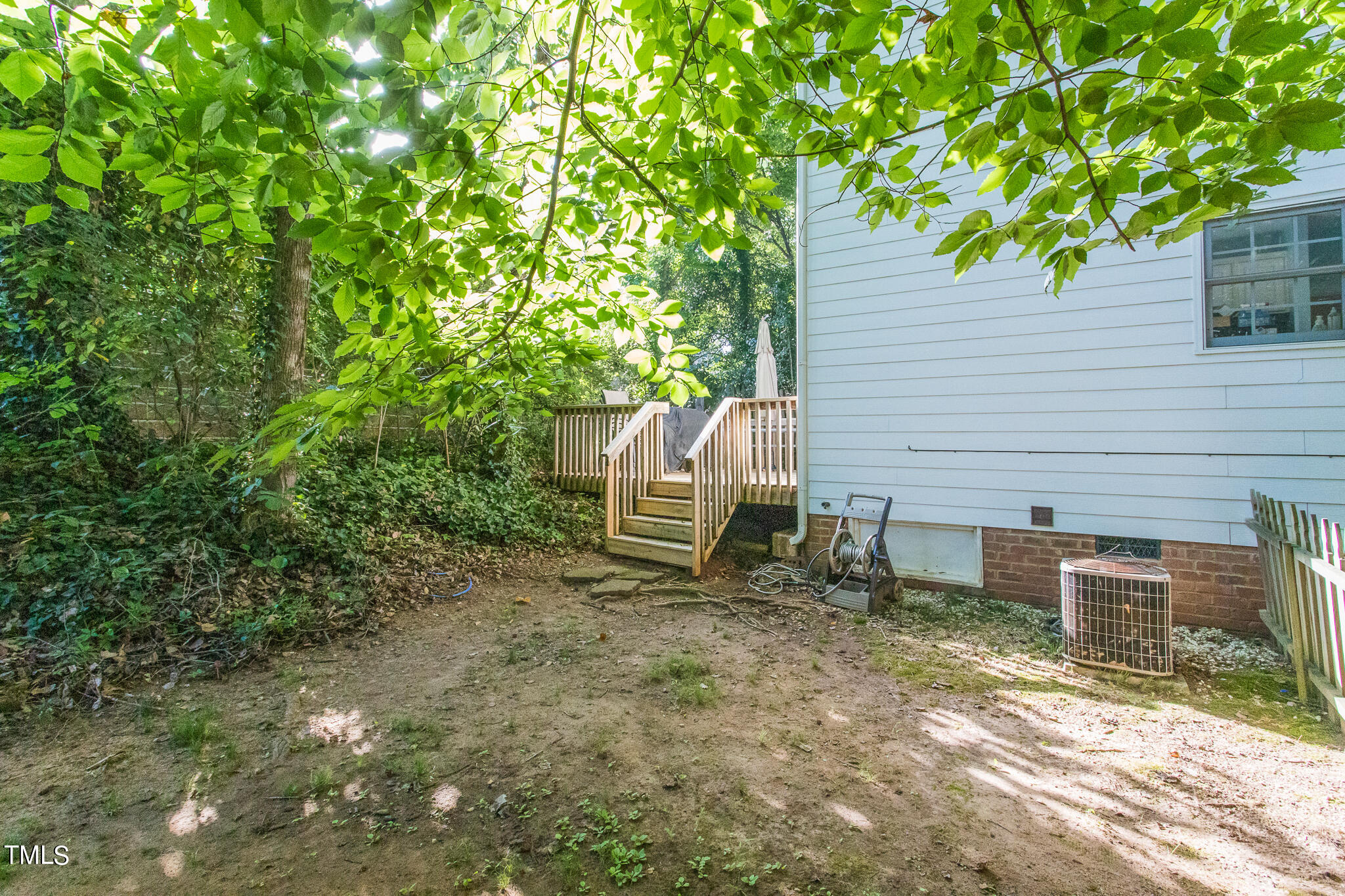 2110 Reaves Drive Raleigh, NC 27608 - Photo 25 of 36 a backyard of a house with table and chairs