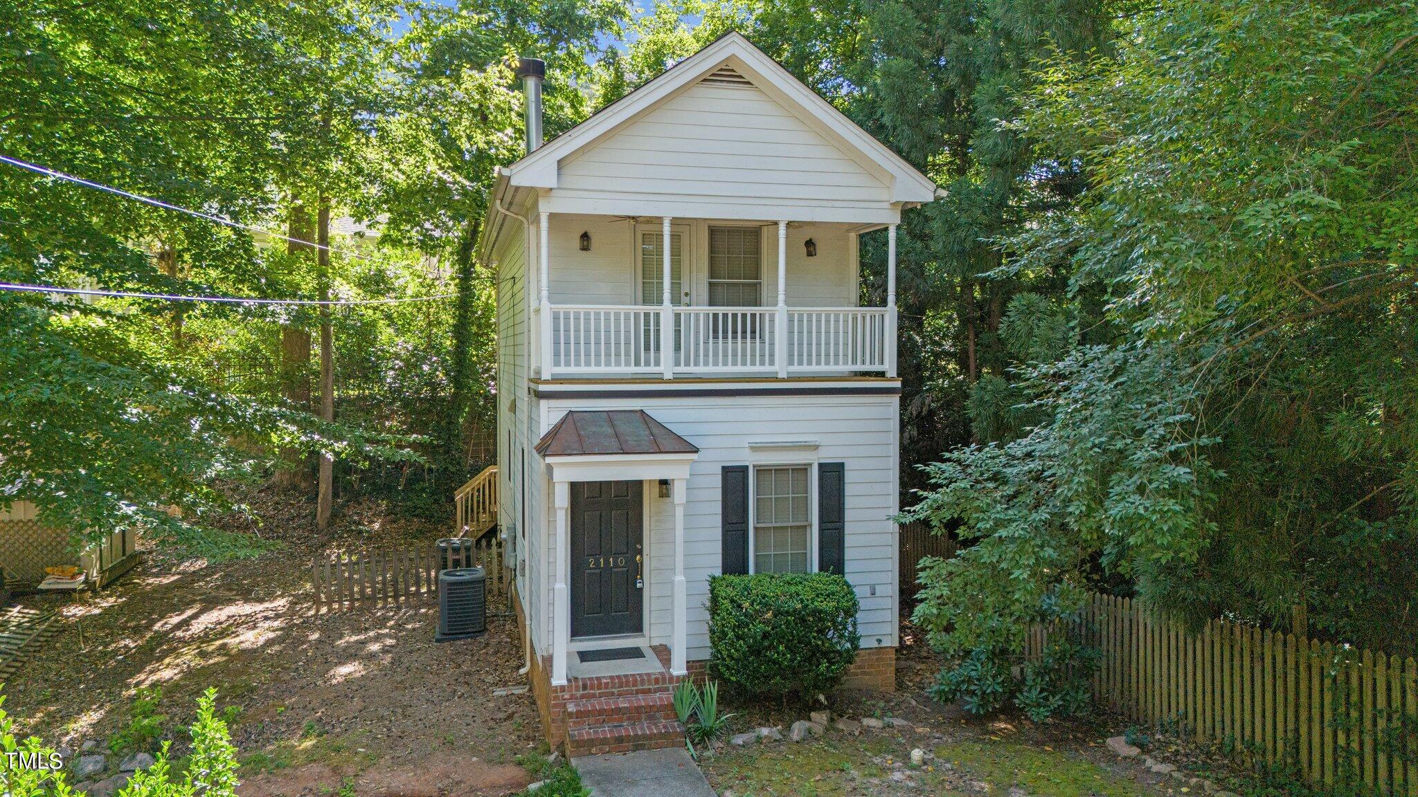 2110 Reaves Drive Raleigh, NC 27608 - Photo 26 of 36 a front view of a house with a garden