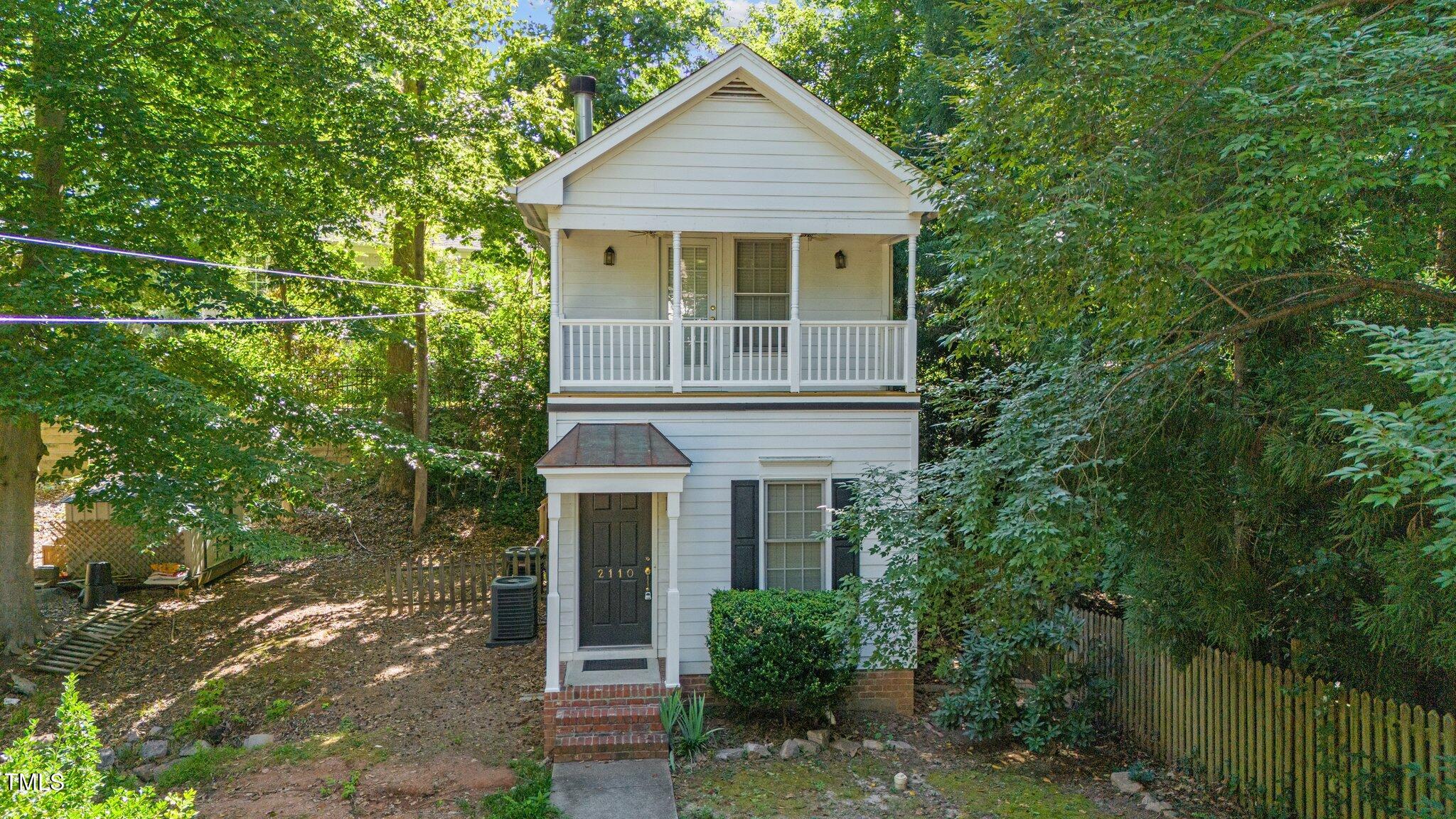 2110 Reaves Drive Raleigh, NC 27608 - Photo 27 of 36 a front view of a house with a garden