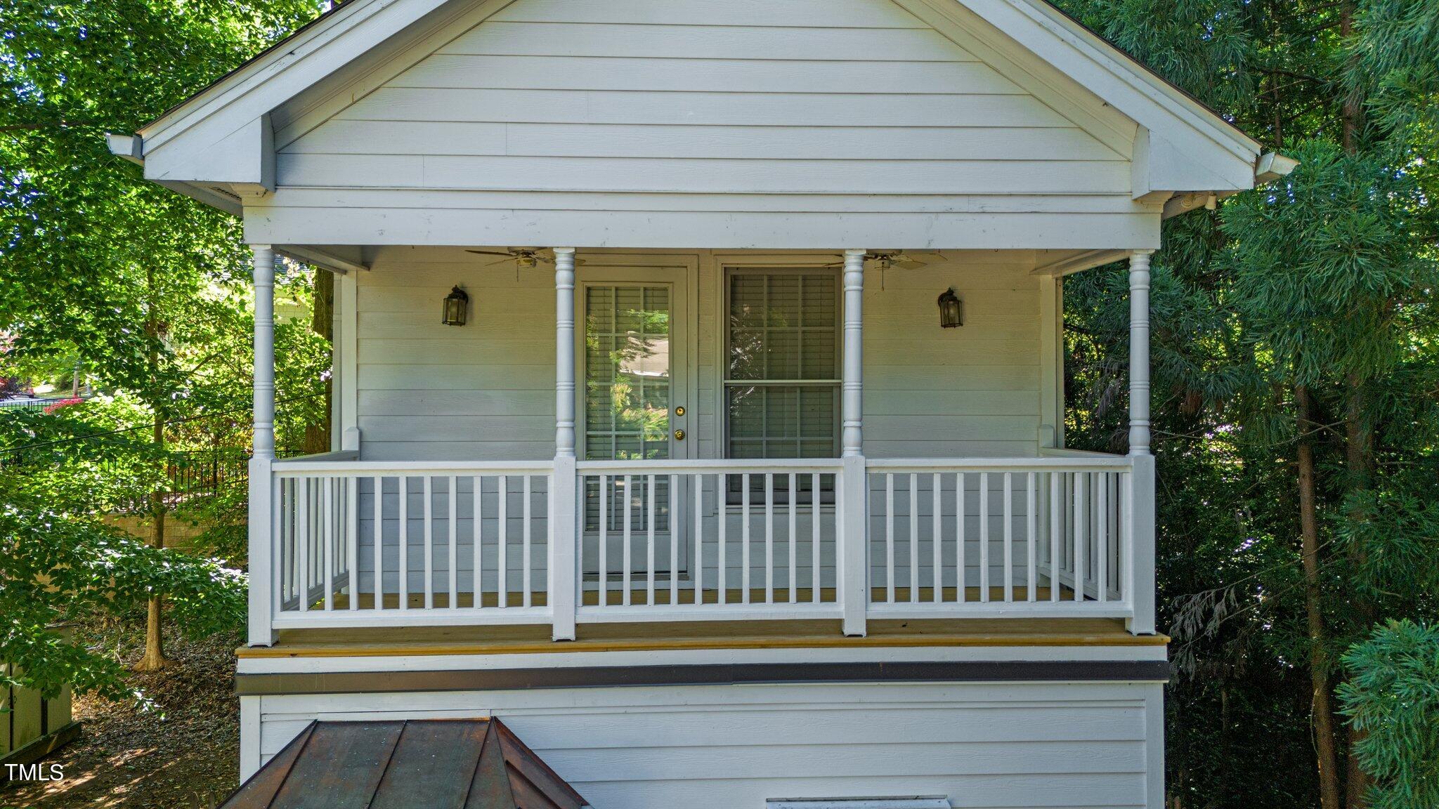 2110 Reaves Drive Raleigh, NC 27608 - Photo 5 of 36 a porch with a bench