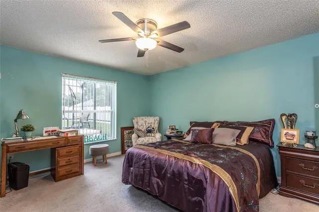 a bedroom with a bed and a table