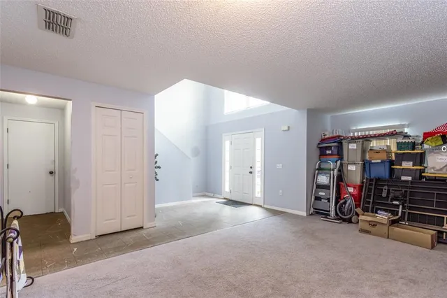 a view of a livingroom with a car garage