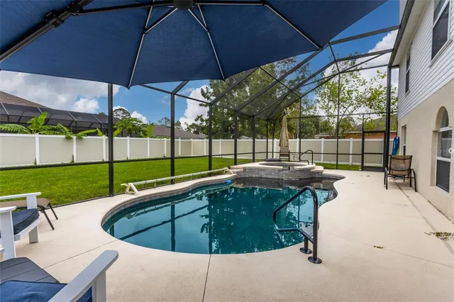 a view of a swimming pool with a porch