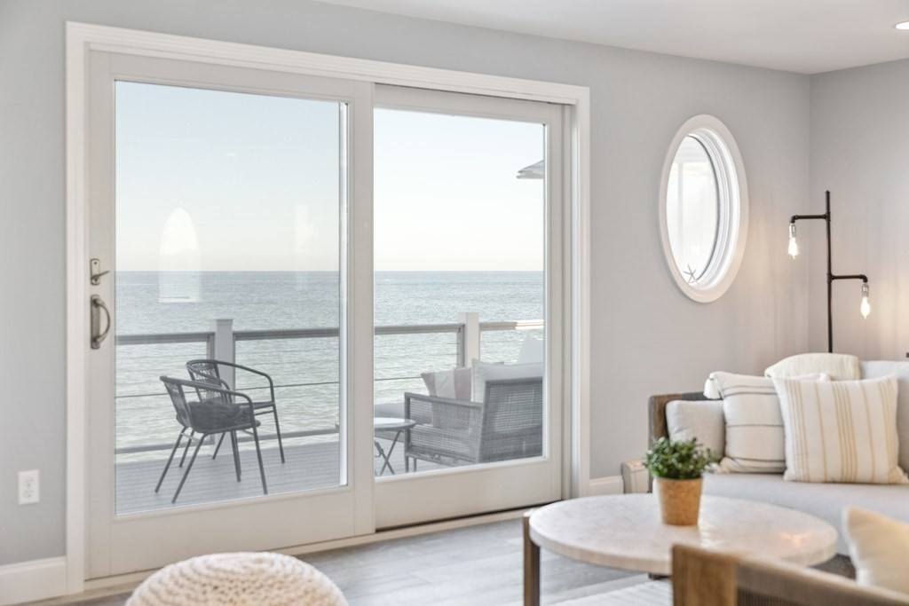 11 Lighthouse Road Scituate, MA 02066 - Photo 7 of 34 a living room with furniture and a large window