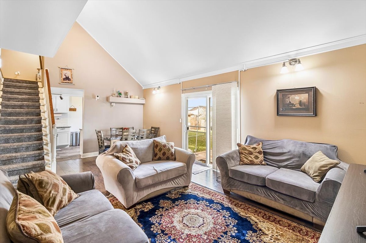 6881 Hickory Street Hanover Park, IL 60133 - Photo 11 of 23 a living room with furniture and a couch