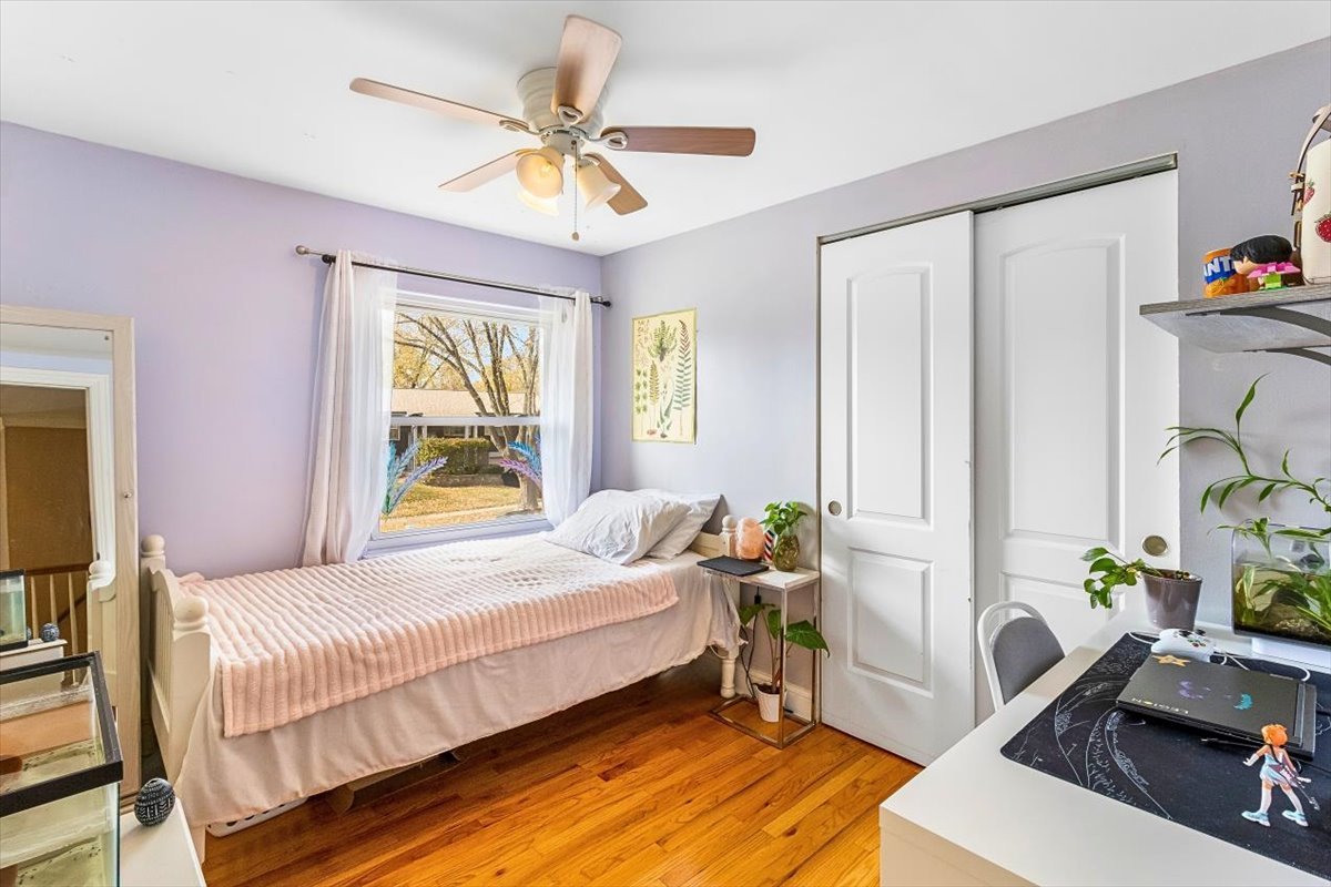 6881 Hickory Street Hanover Park, IL 60133 - Photo 6 of 23 a bedroom with a bed furniture and a window