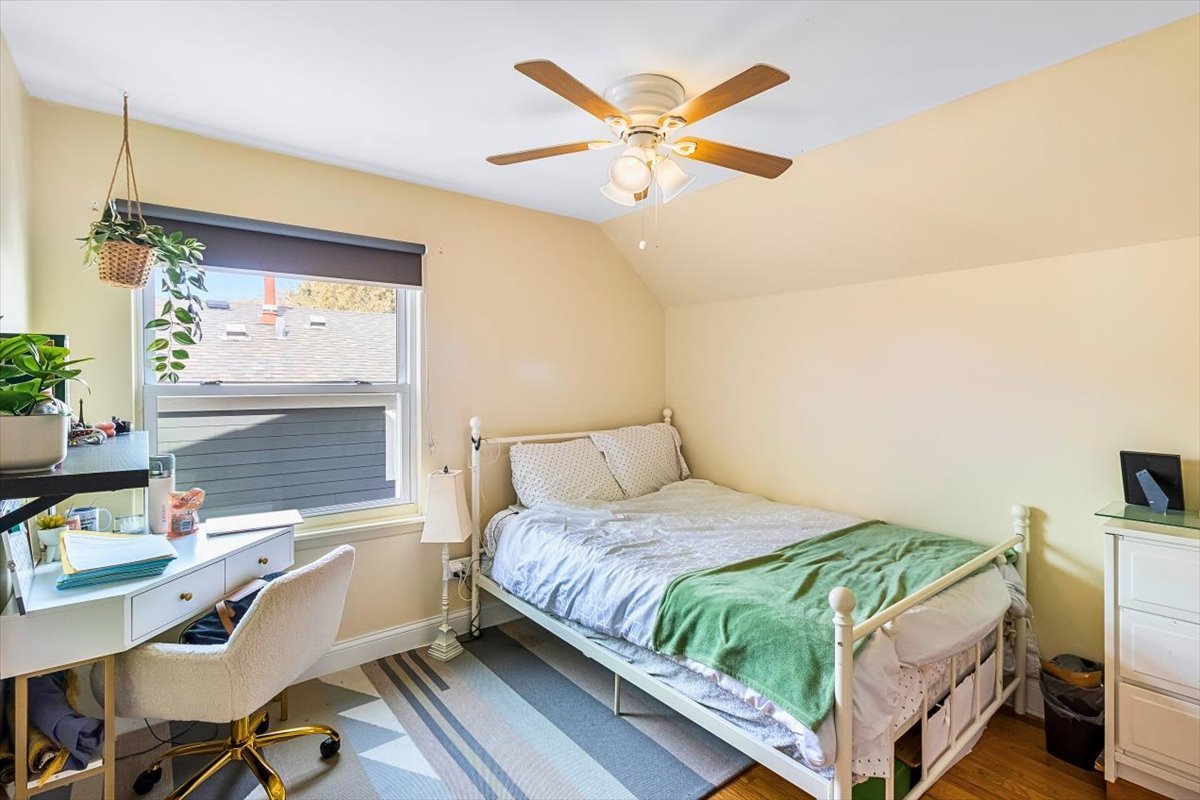 6881 Hickory Street Hanover Park, IL 60133 - Photo 7 of 23 a bedroom with a bed and a desk