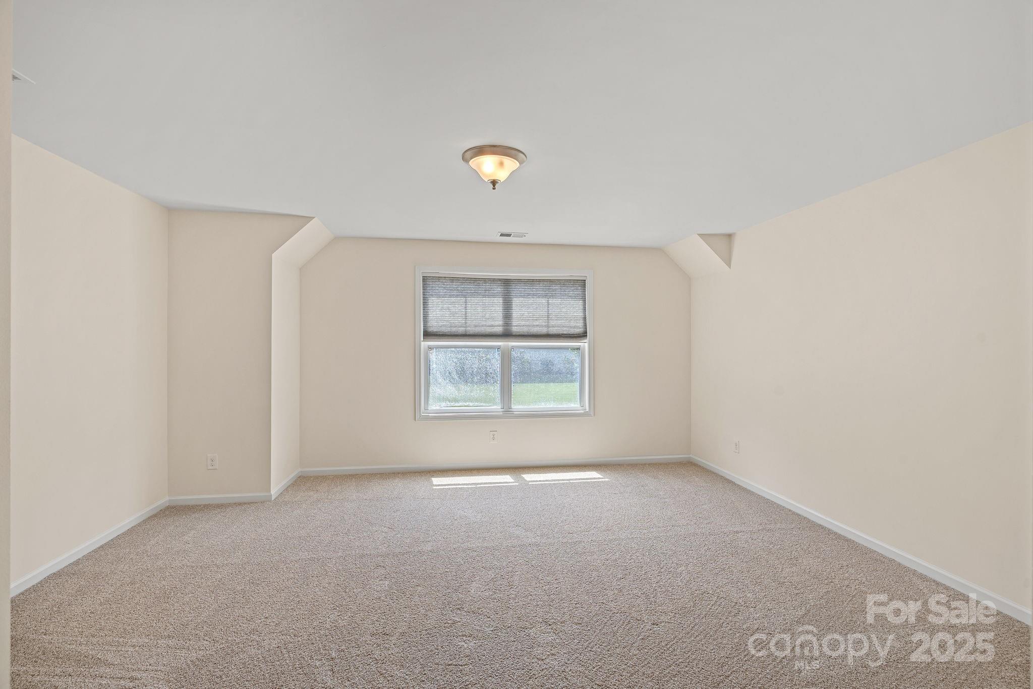 2079 Lakebridge Drive Fort Mill, SC 29715 - Photo 17 of 33 a view of an empty room with a window