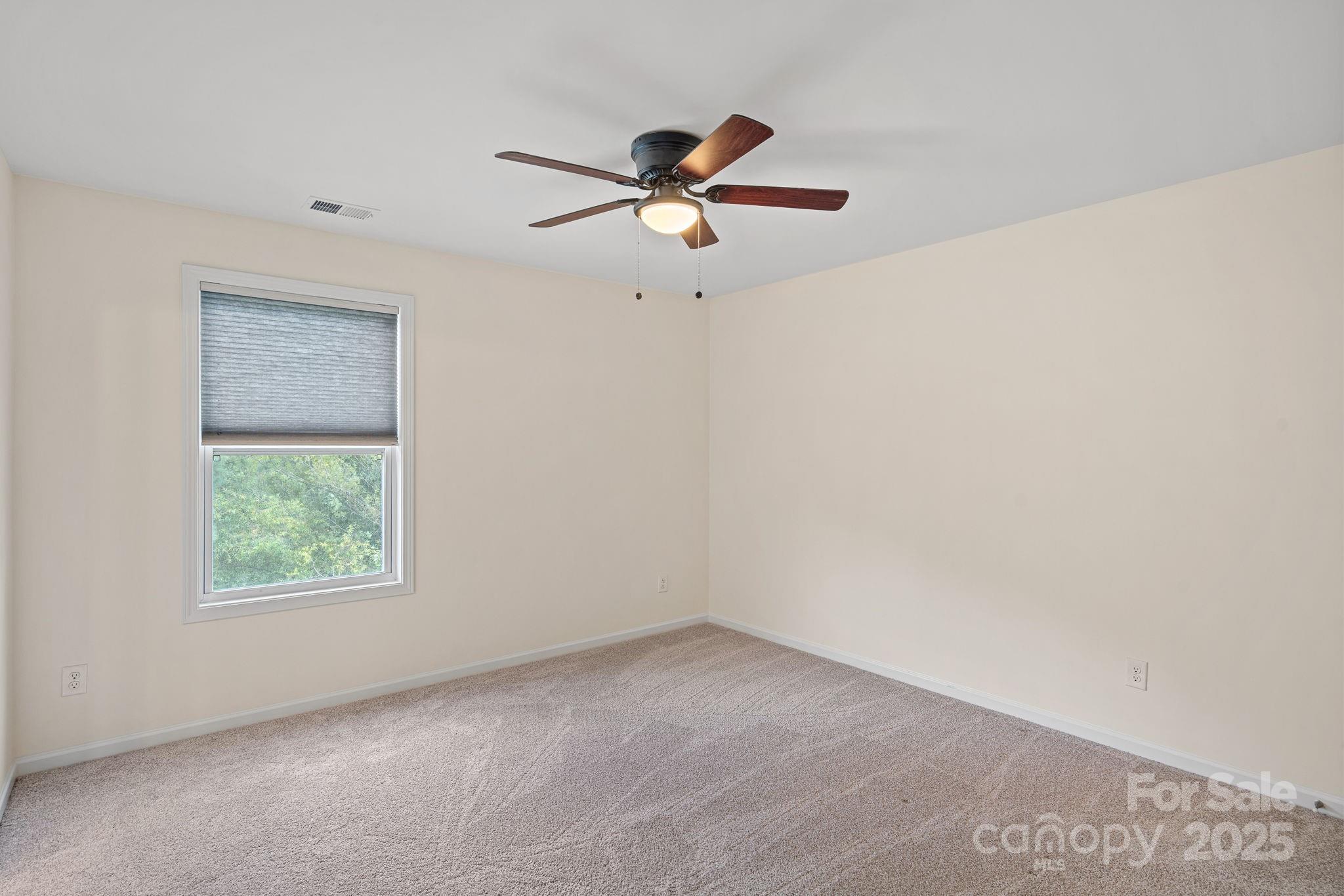2079 Lakebridge Drive Fort Mill, SC 29715 - Photo 21 of 33 a view of an empty room with a window