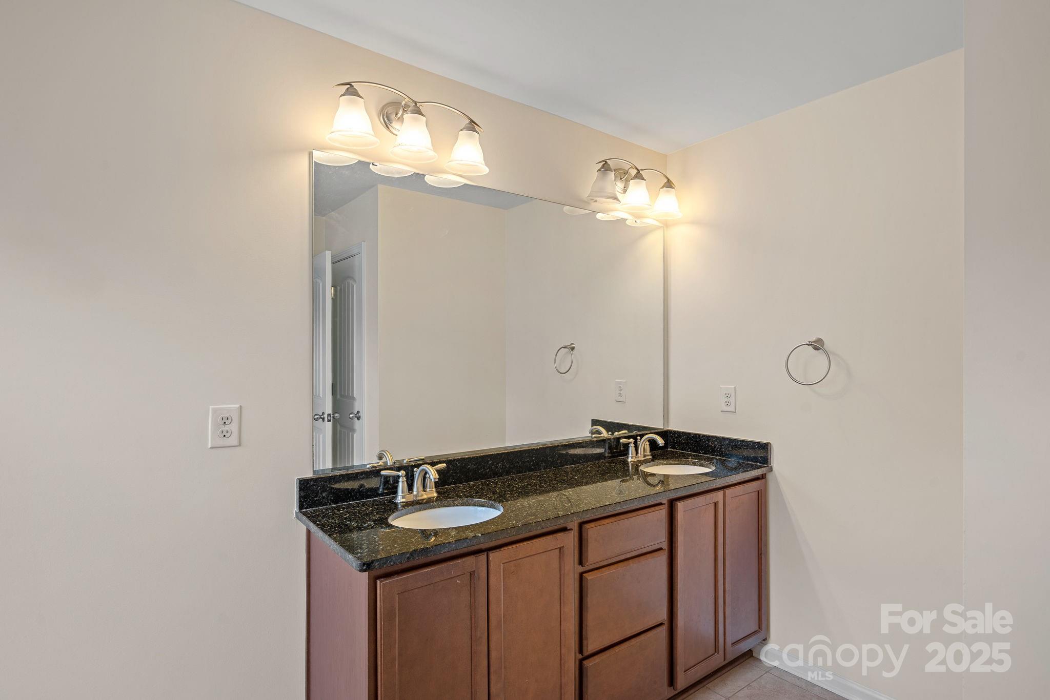 2079 Lakebridge Drive Fort Mill, SC 29715 - Photo 27 of 33 a bathroom with a sink and a mirror