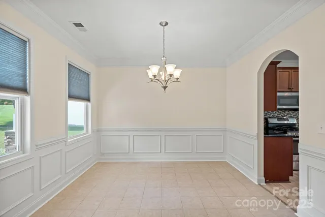 a view of a room with window and cabinet