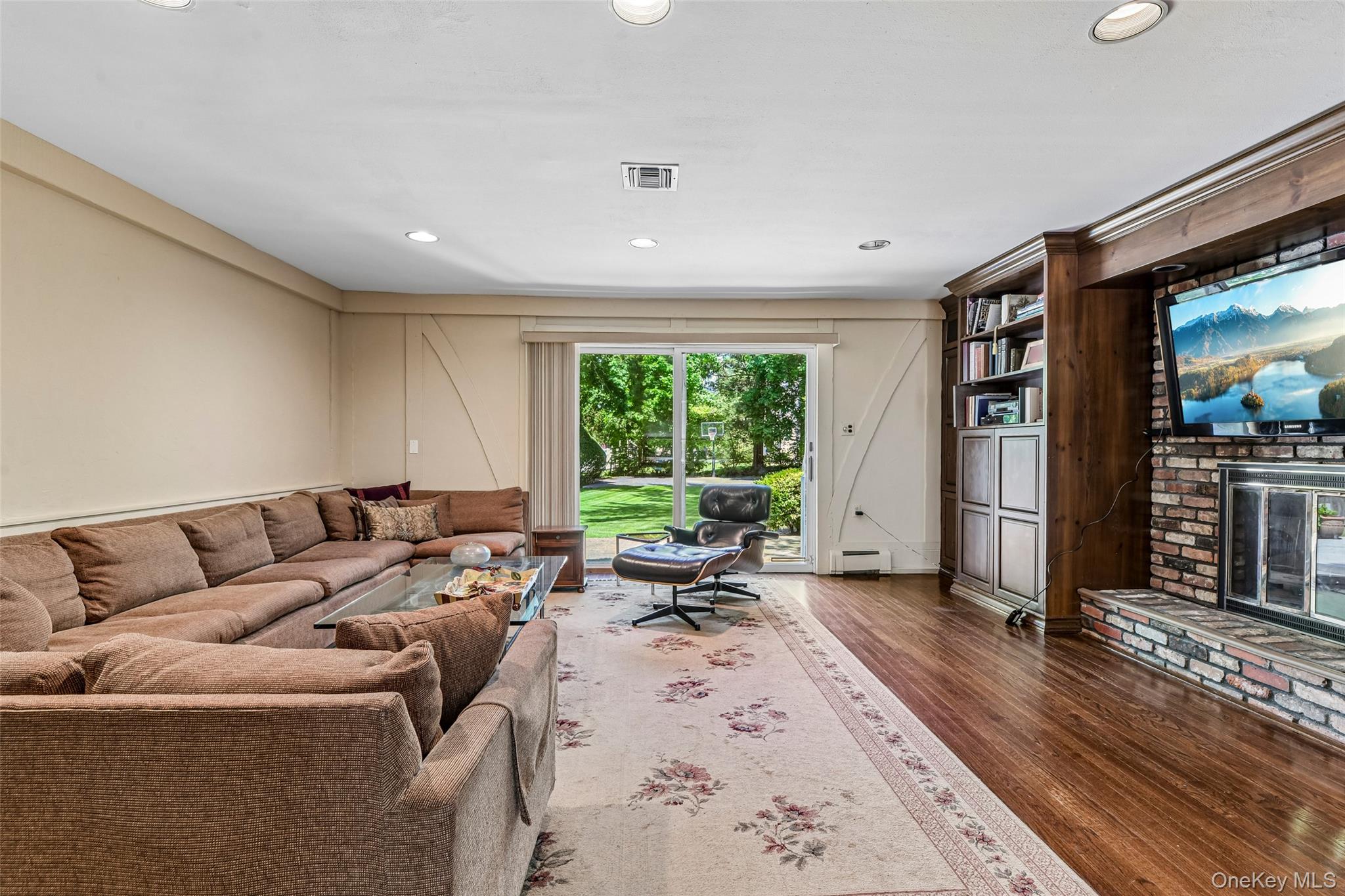 100 Hewlett Neck Road Woodmere, NY 11598 - Photo 19 of 45 a living room with furniture or window and a wooden floor