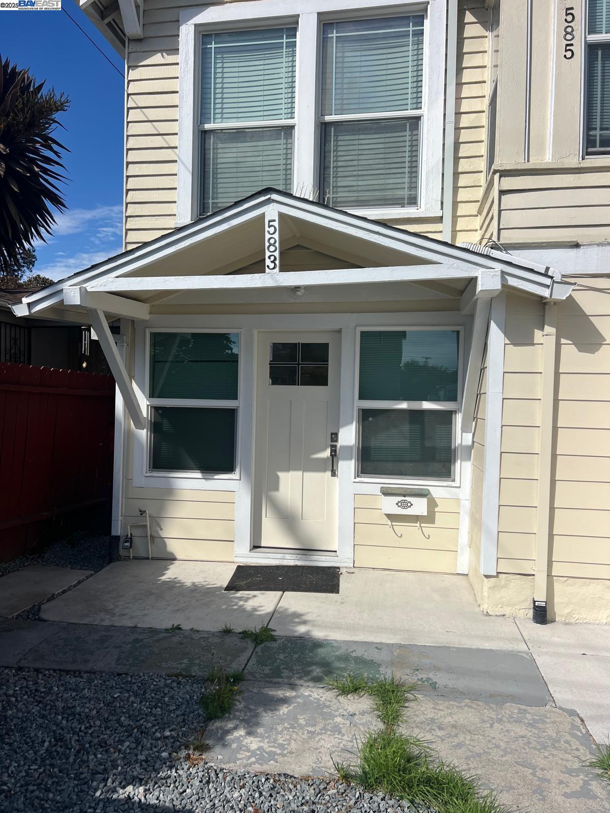 583 8th Street Richmond, CA 94801 - Photo 1 of 2 a front view of a house with a yard