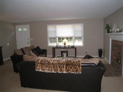 46 Cap'n Jac's Road Centerville, MA 02632 - Photo 4 of 25 a living room with furniture and a fireplace