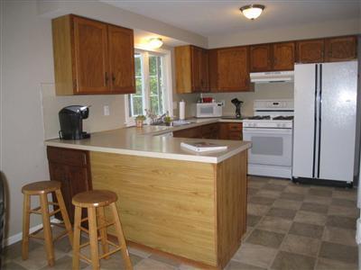 46 Cap'n Jac's Road Centerville, MA 02632 - Photo 9 of 25 a kitchen with a cabinets and refrigerator