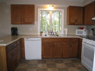 46 Cap'n Jac's Road Centerville, MA 02632 - Photo 10 of 25 a kitchen with a sink cabinets and window