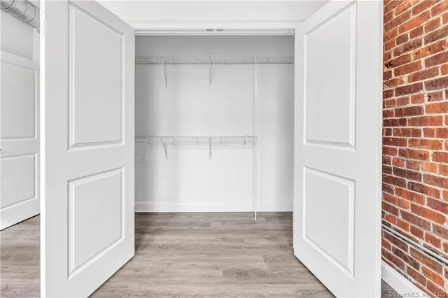 a view of an empty walk in closet
