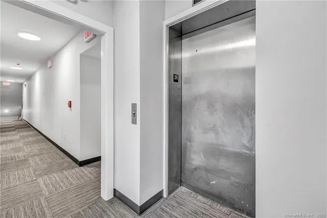 a bathroom with a glass shower door