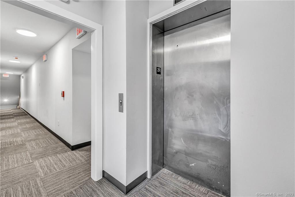 475 Howe Avenue, Unit 5 Shelton, CT 06484 - Photo 27 of 31 a bathroom with a glass shower door