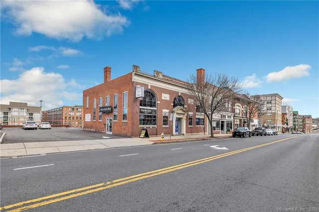 a city street with tall buildings