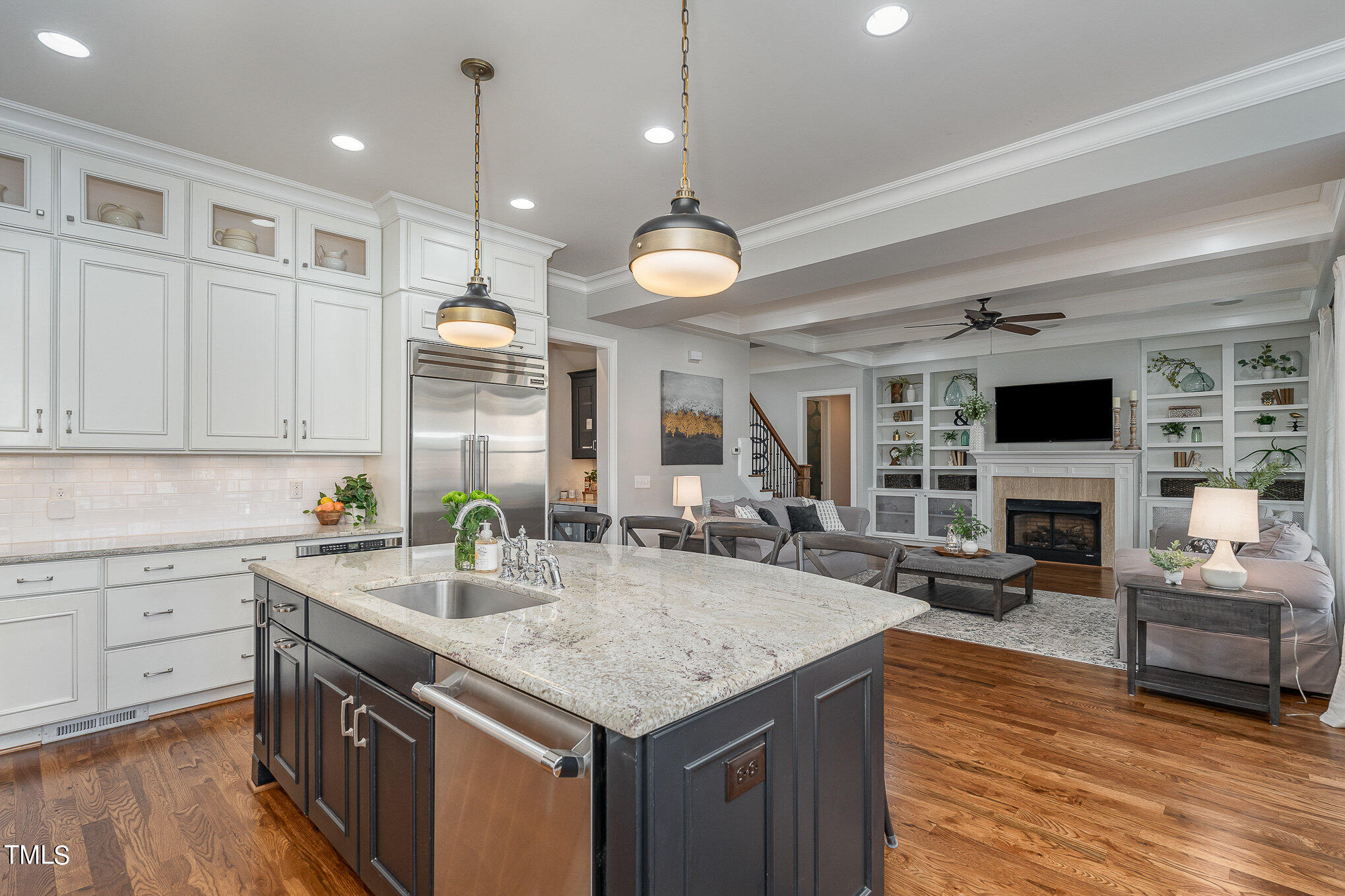 10632 Marion Stone Way Raleigh, NC 27614 - Photo 20 of 95 a kitchen with stainless steel appliances granite countertop a sink a stove and a wooden floors