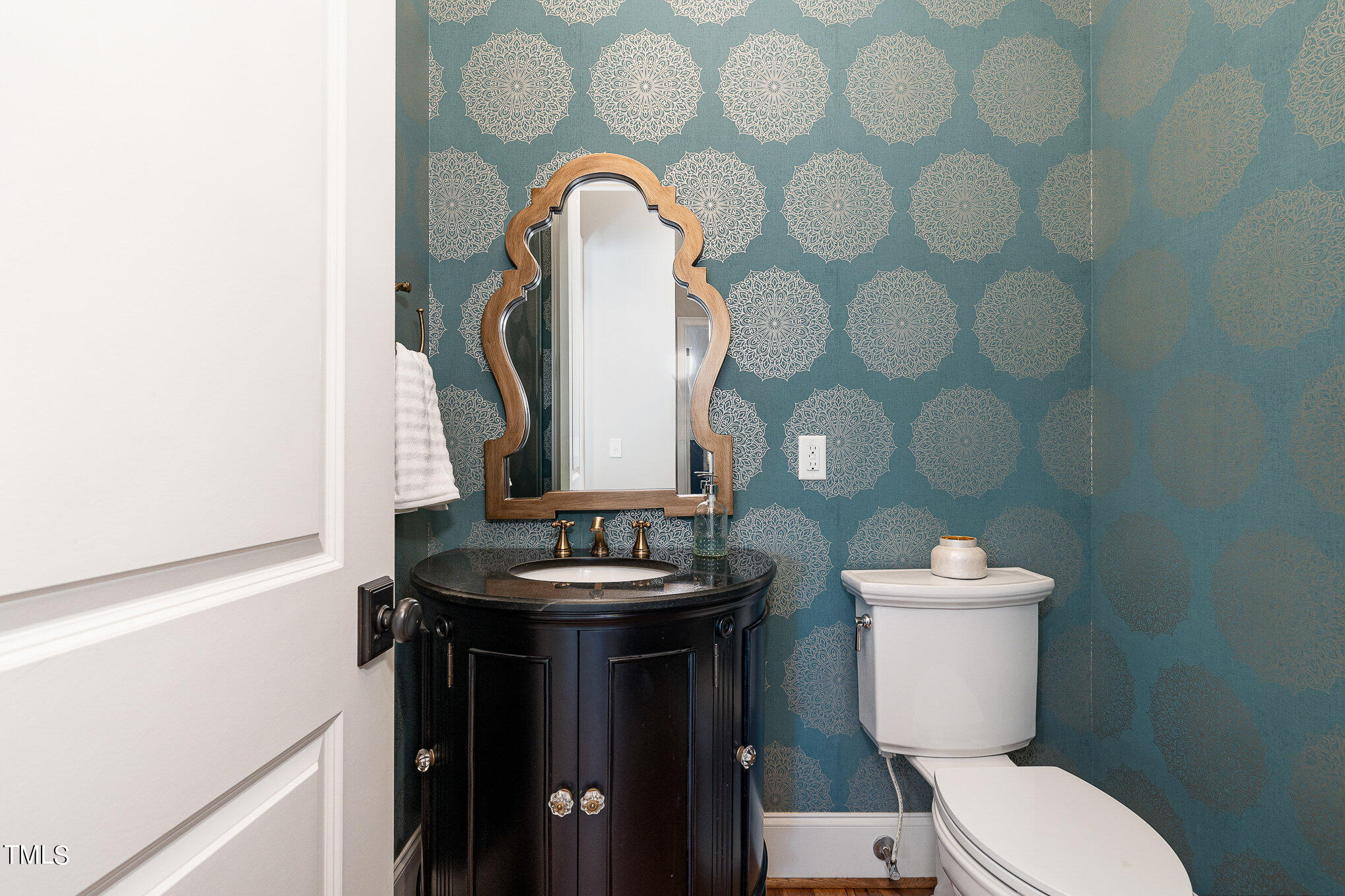 10632 Marion Stone Way Raleigh, NC 27614 - Photo 24 of 95 a bathroom with a toilet sink and mirror