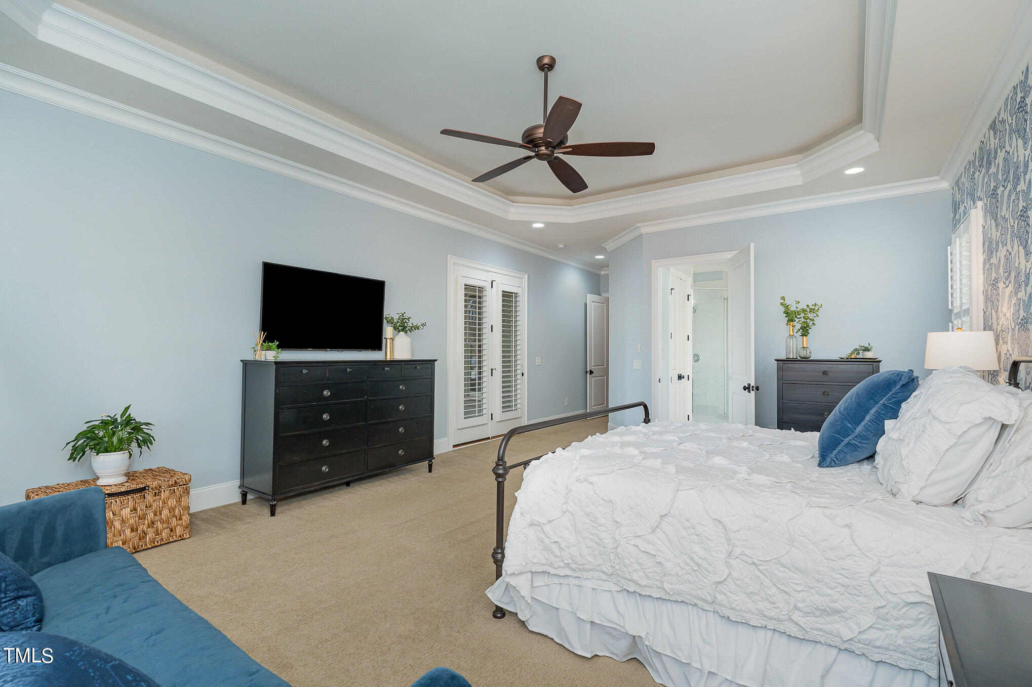 10632 Marion Stone Way Raleigh, NC 27614 - Photo 27 of 95 a bedroom with a bed and a flat screen tv