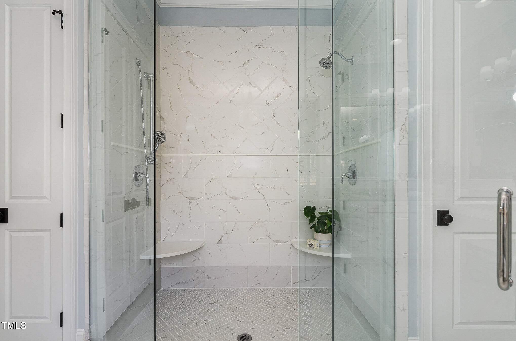 10632 Marion Stone Way Raleigh, NC 27614 - Photo 33 of 95 a bathroom with a glass shower door