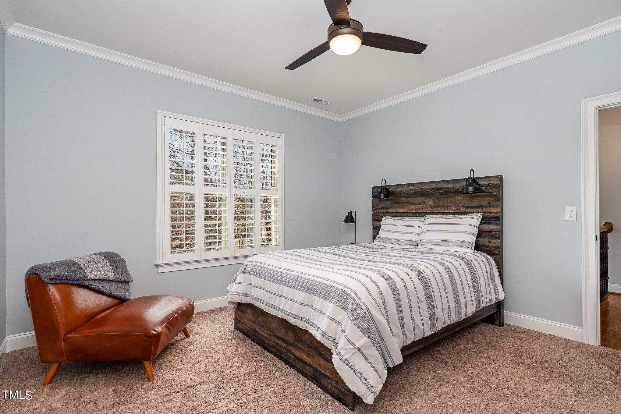 10632 Marion Stone Way Raleigh, NC 27614 - Photo 39 of 95 a bedroom with a bed and a couch