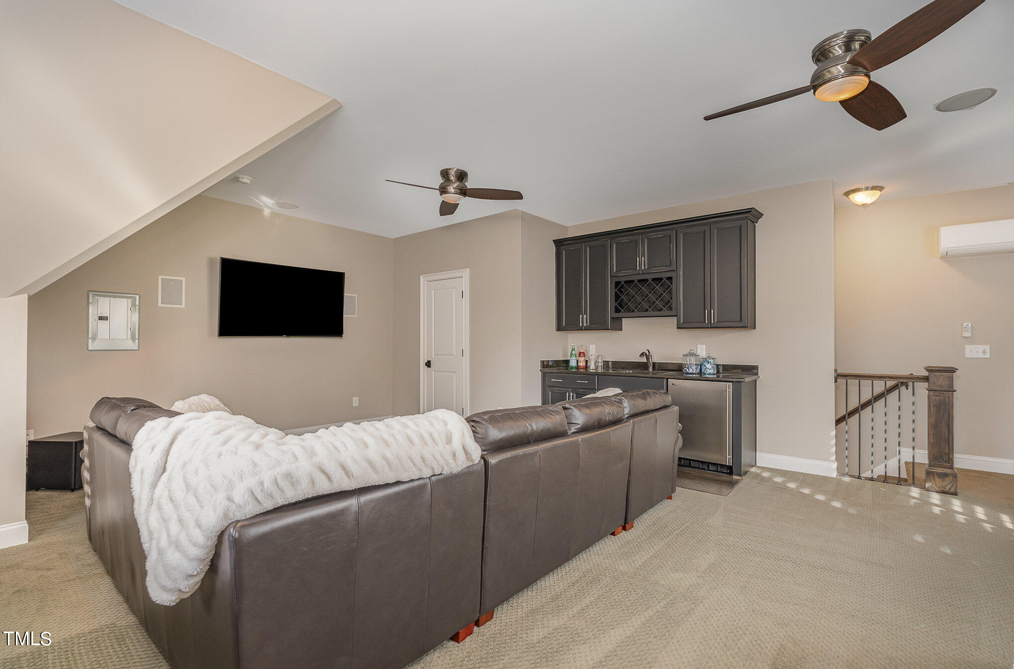 10632 Marion Stone Way Raleigh, NC 27614 - Photo 43 of 95 a living room with furniture and a flat screen tv