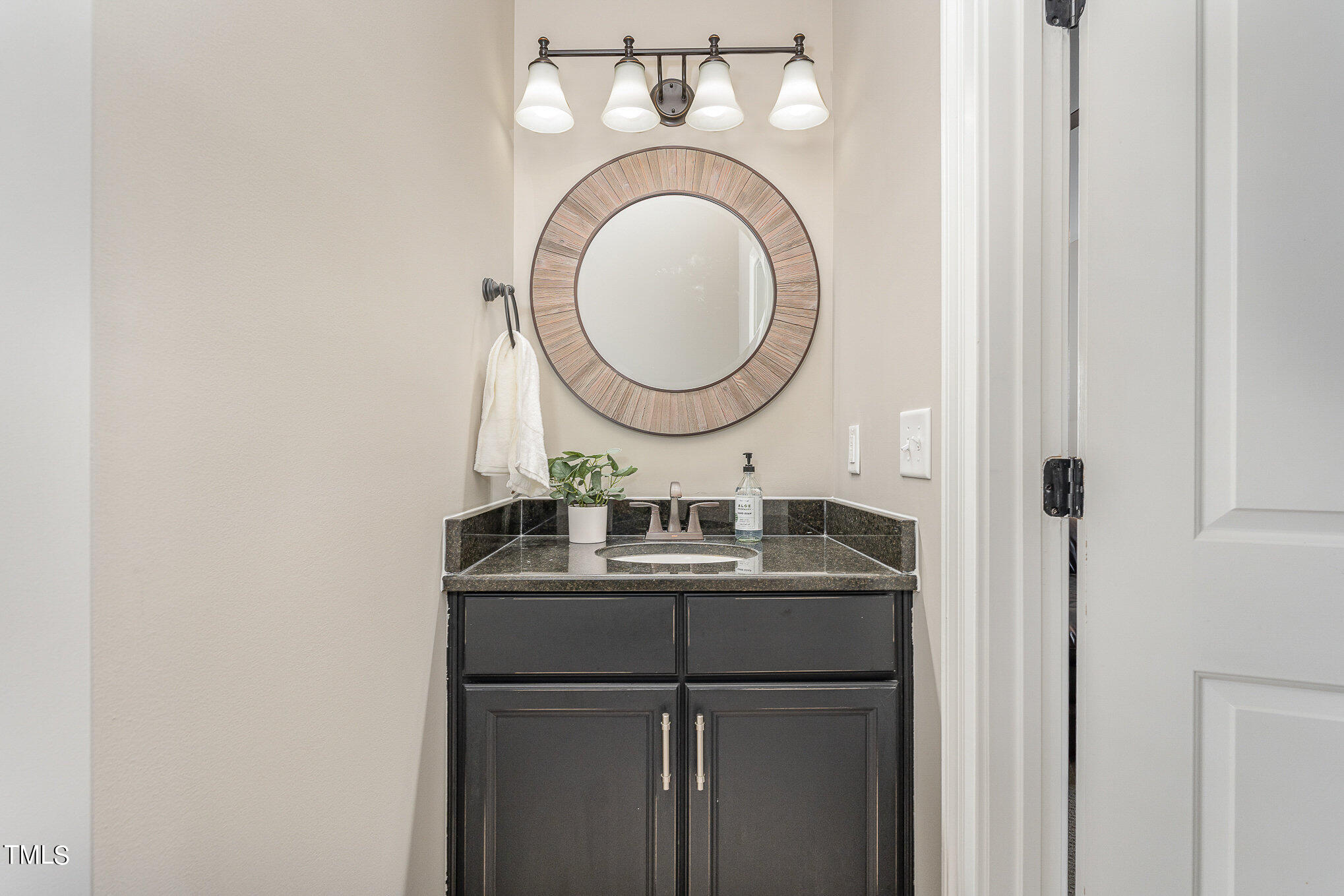 10632 Marion Stone Way Raleigh, NC 27614 - Photo 47 of 95 a bathroom with a sink and a mirror