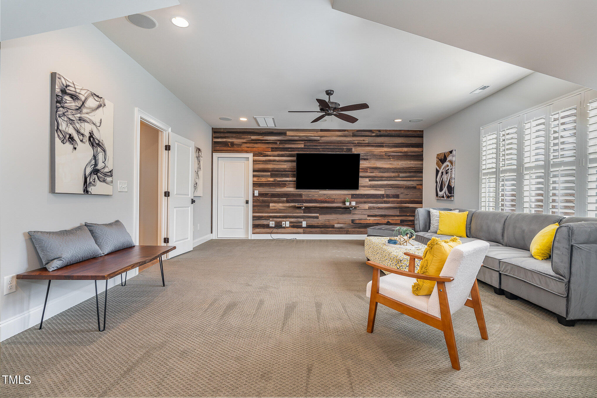 10632 Marion Stone Way Raleigh, NC 27614 - Photo 48 of 95 a living room with furniture and a flat screen tv