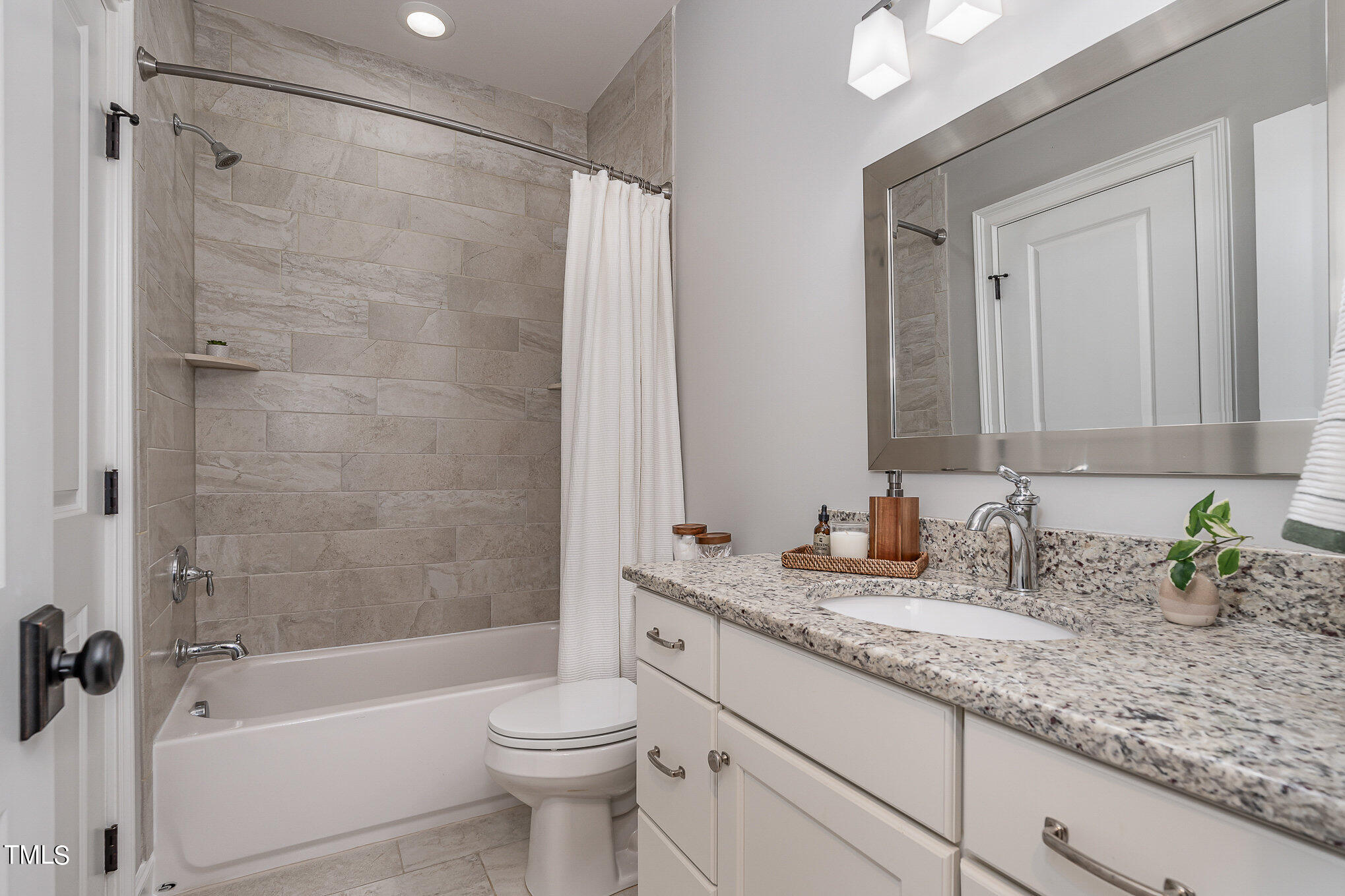 10632 Marion Stone Way Raleigh, NC 27614 - Photo 51 of 95 a bathroom with a granite countertop sink a toilet and shower