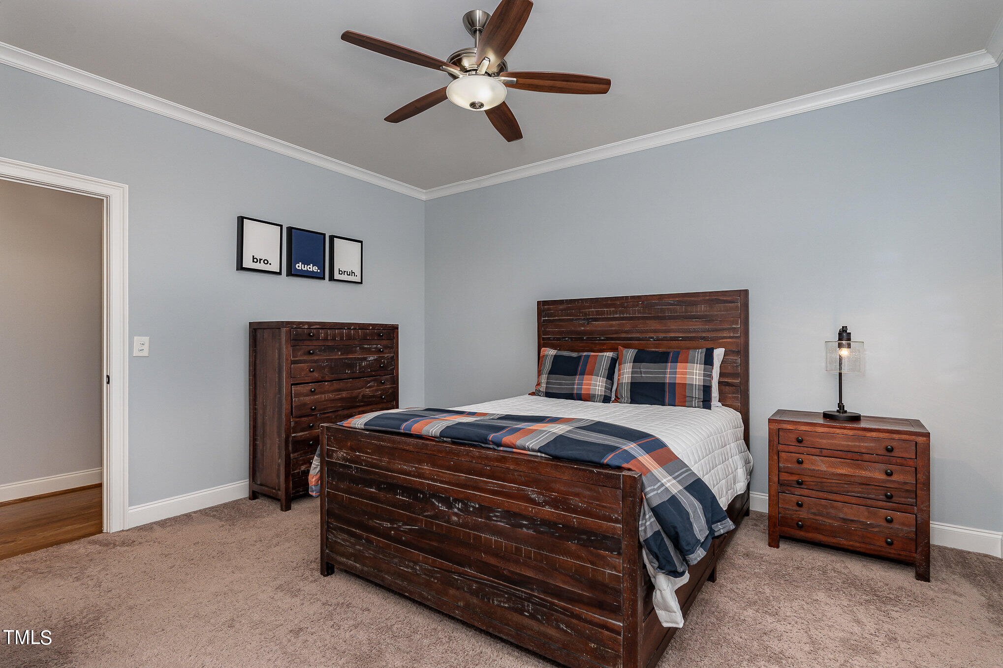 10632 Marion Stone Way Raleigh, NC 27614 - Photo 55 of 95 a bedroom with a bed and a ceiling fan