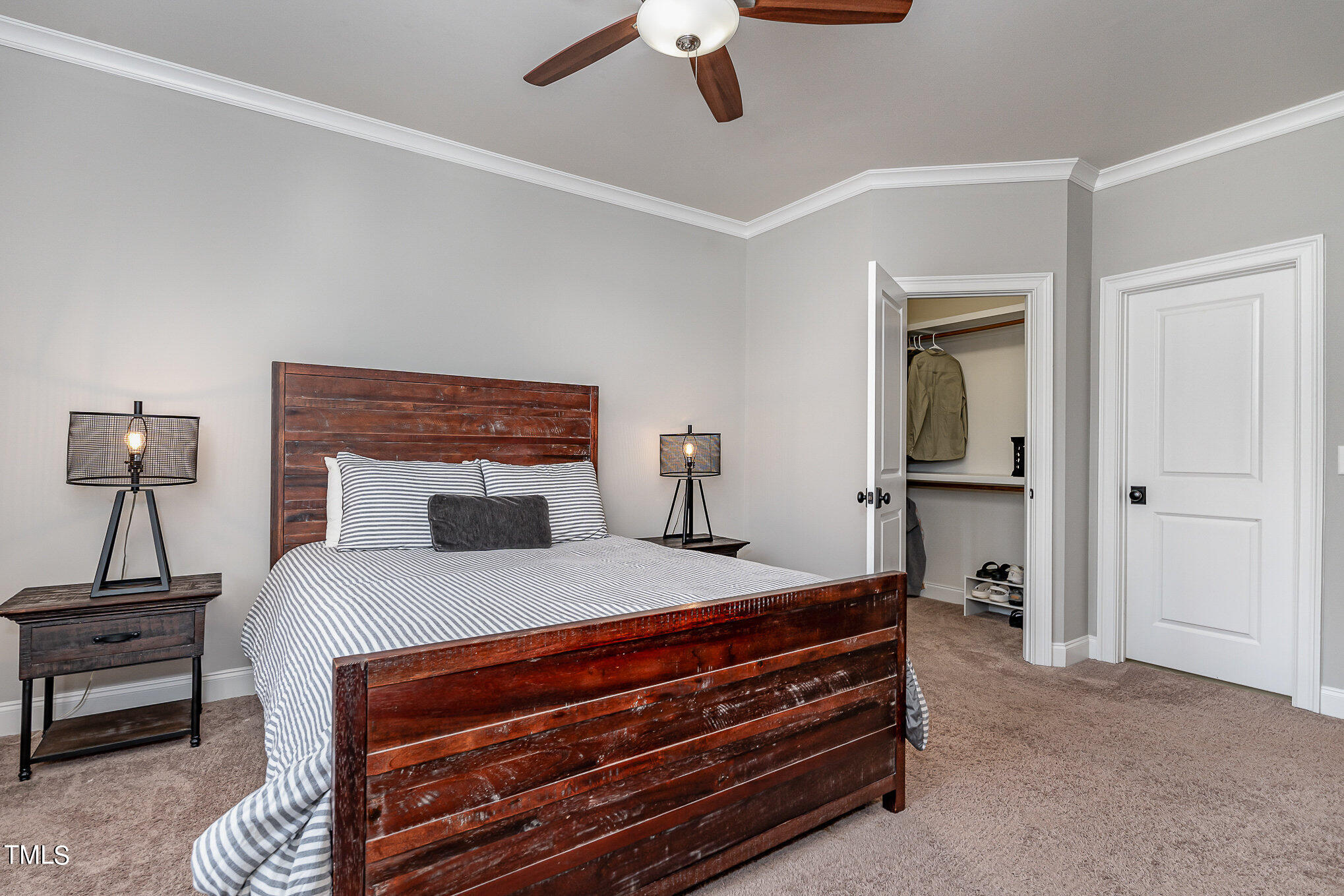 10632 Marion Stone Way Raleigh, NC 27614 - Photo 57 of 95 a bedroom with a bed and a chandelier