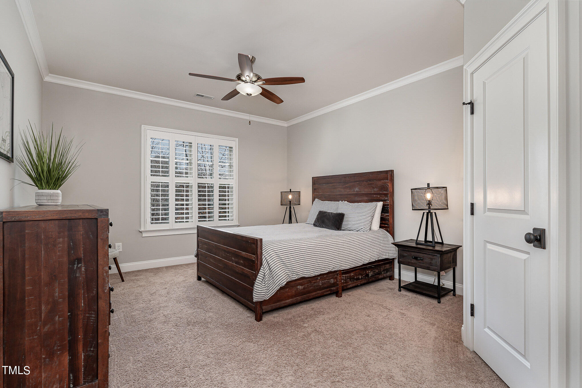 10632 Marion Stone Way Raleigh, NC 27614 - Photo 58 of 95 a spacious bedroom with a bed and a window