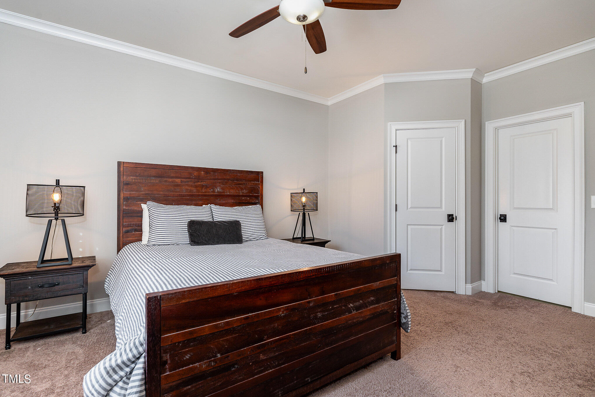 10632 Marion Stone Way Raleigh, NC 27614 - Photo 61 of 95 a bedroom with a bed and a chandelier